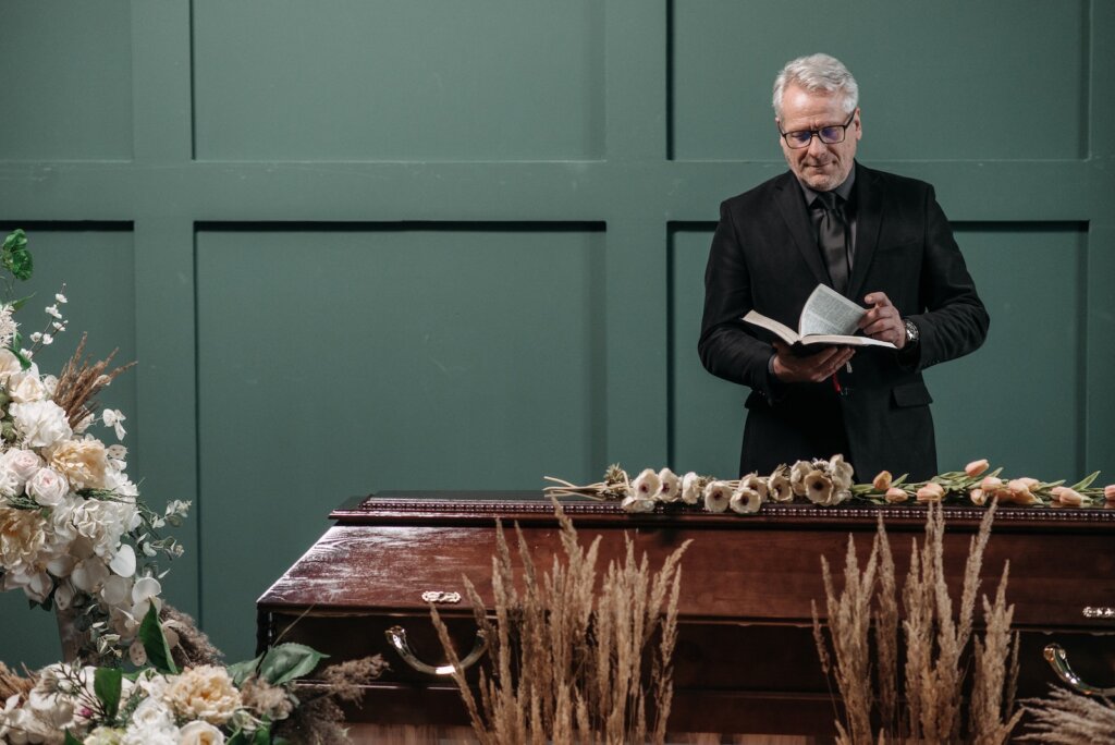 A Pastor Conducting the Funeral Service